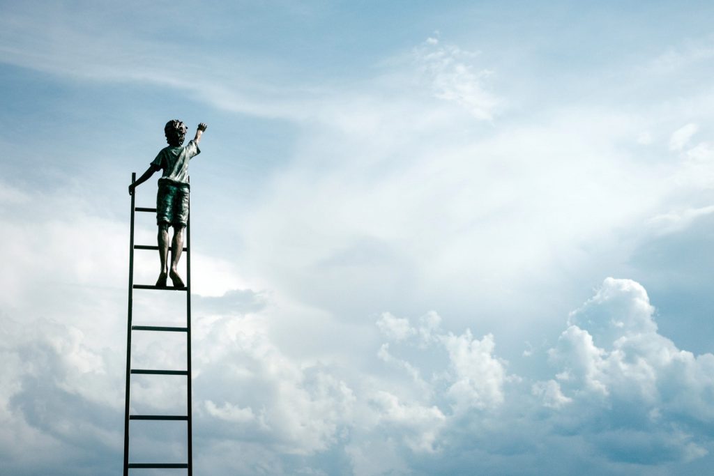 Boy climbing latter