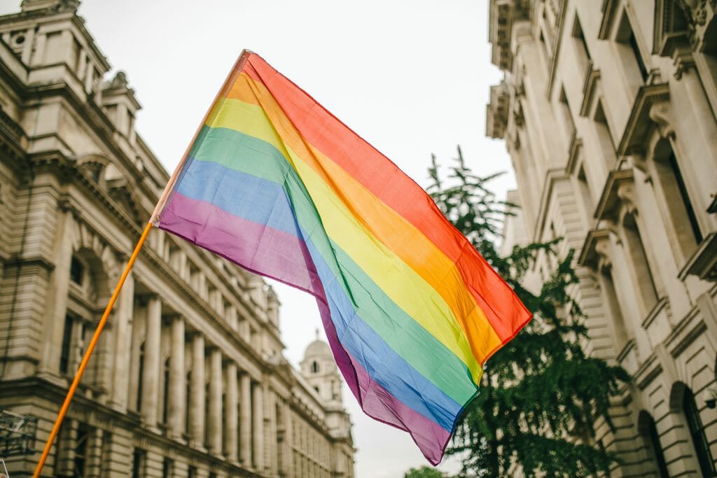 pride flag between buidlings