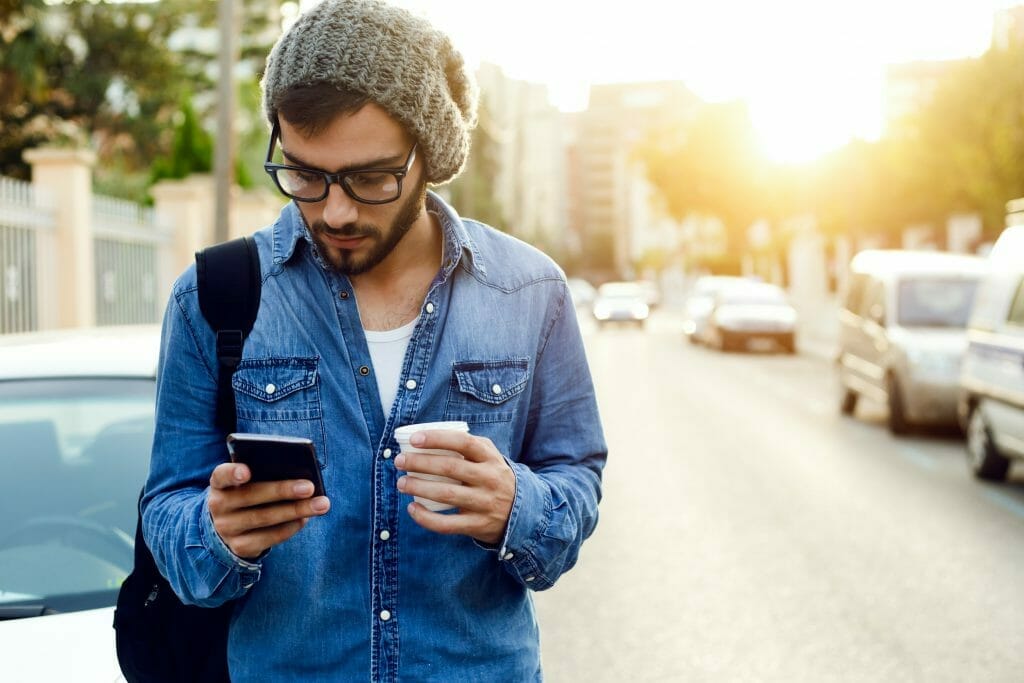 man-looking-at-cell-phone