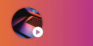 a close up shot of a laptop keyboard in a dark room with the screen color illuminating the keyboard in a circle frame on a fuel cycle color gradient background