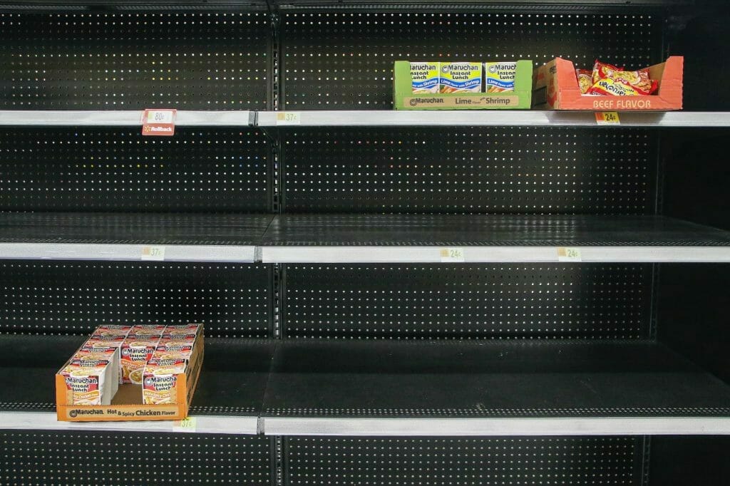 an image of an almost empty shelf for instant food